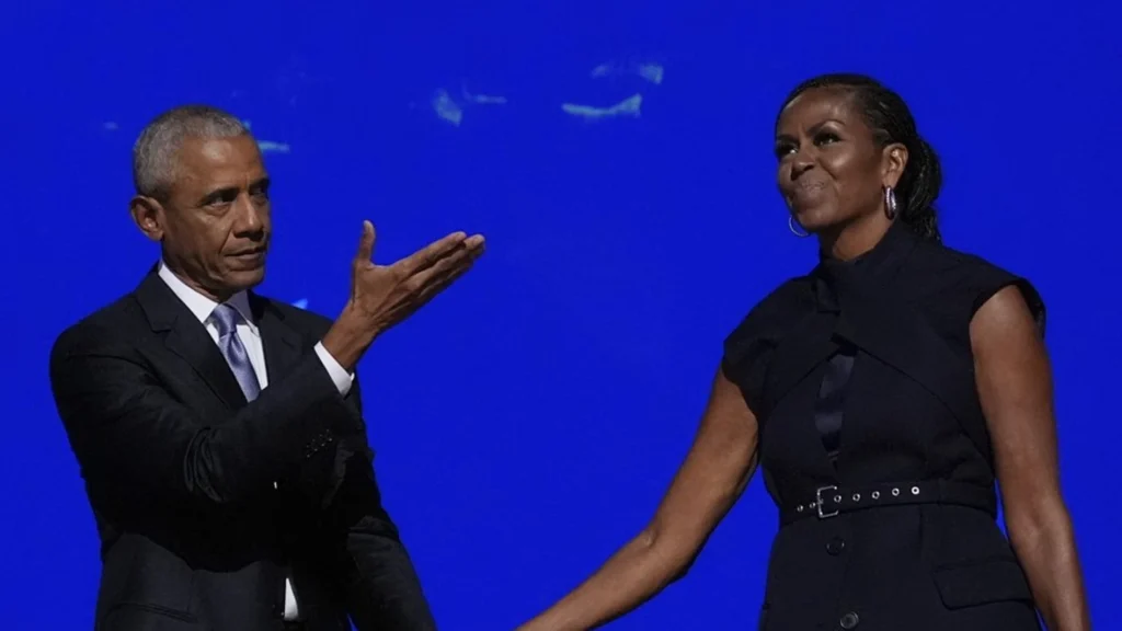 former president barack obama hugs former first lady michelle obama introduced during the democratic national convention tuesday aug 20 2024 chicago 98