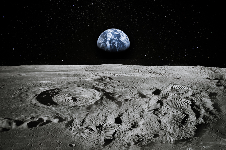 view of moon limb with earth rising on the horizon. footprints as an evidence of people being there or great forgery. collage. elements of this image furnished by nasa.